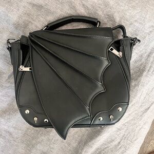 Bat wing purse
